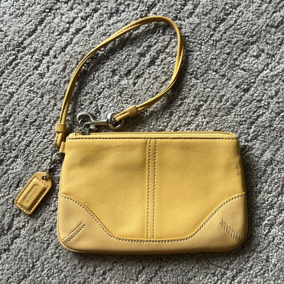 Coach Handbags - Coach Yellow Leather Wristlet with Minimalist Design
